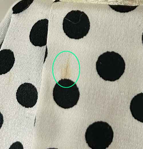 Sample doll /Alte*skirt has a stain.